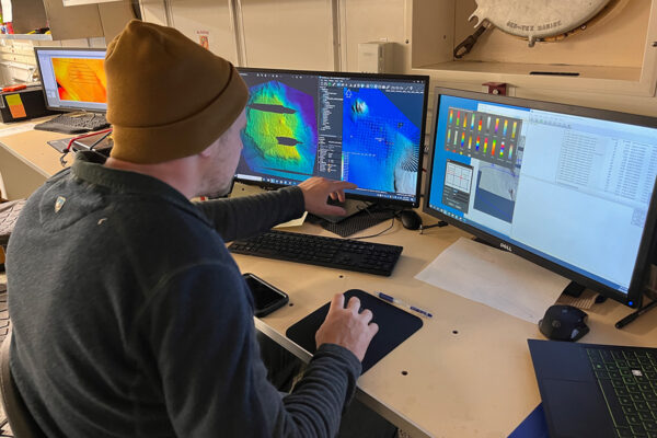 SDSU Masters student Bradley Keith processes geophysical data to create maps of the seafloor.