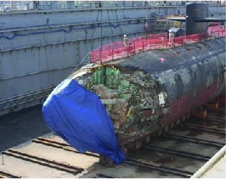 Damage to USS San Francisco, a Los Angeles class nuclear submarine, following a crash into an uncharted seamount in January 2005. The crash occurred at a depth of ~150 m while the submarine was traveling a speed of 30 knots. US Navy charts had a depth of more than 2000 m at the crash site.